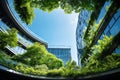 Eco-friendly building in the modern city. Sustainable glass office building with tree for reducing carbon dioxide. Office building