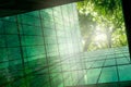 Eco-friendly building in modern city. Sustainable glass office building with trees for reducing CO2. Green architecture. Building Royalty Free Stock Photo