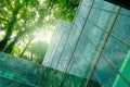 Eco-friendly building in modern city. Sustainable glass office building with trees for reducing CO2. Green architecture. Building Royalty Free Stock Photo