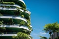 Eco-friendly building in the modern city. Sustainable glass office building with tree for reducing carbon dioxide. Office building