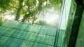 Eco-friendly building in modern city. Sustainable glass office building with trees for reducing CO2. Green architecture. Building Royalty Free Stock Photo