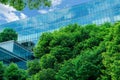 Eco-friendly building in modern city. Sustainable glass office building with trees for reducing CO2. Green architecture. Building Royalty Free Stock Photo