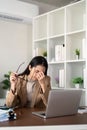 Eco friendly, businesswoman young asian stress in working on laptop while sitting at home office Royalty Free Stock Photo