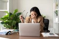 Eco friendly, businesswoman young asian stress in working on laptop while sitting at home office Royalty Free Stock Photo