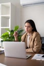 Eco friendly, businesswoman young asian stress in working on laptop while sitting at home office, green room area Royalty Free Stock Photo