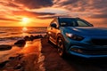 Eco friendly charisma Blue compact SUV parked by the sea at sunset