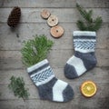 Eco Friendly Christmas flat lay. Winter holiday in Hygge style. Knitted childs socks with fir branches, handmade toy snowman and Royalty Free Stock Photo