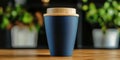 Eco-Friendly Coffee Drink Container on Oak Table Surrounded by Lush Greenery in Nature Setting Royalty Free Stock Photo