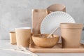 Eco friendly dishes. Disposable paper cups, dishes, fast food containers, wooden bowl and bamboo cutlery