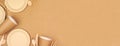 Eco friendly, plastic free disposable dishware for takeout. Corner border on a brown paper background. Royalty Free Stock Photo