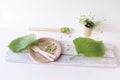 Eco-friendly disposable tableware from natural materials and green leaves on a light background, the concept of ecology, zero wast Royalty Free Stock Photo