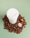Eco-friendly disposable white paper cup with coffee beans and capsules, mock up design Royalty Free Stock Photo
