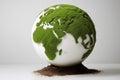 Eco-Friendly Earth Globe with Green Moss Texture and Soil Base - Environmental Sustainability Concept Royalty Free Stock Photo