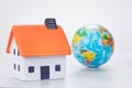 Eco-friendly efficient house concept with globe Royalty Free Stock Photo