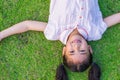 Eco friendly environment concept with happy healthy Asian kid or school girl child having fun relaxing outdoor park on natural Royalty Free Stock Photo