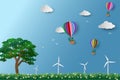 Eco friendly and environment conservation concept,colorful hot air balloon with tree flying over the meadow