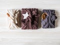 Eco-friendly fabric reusable gifts packaging with ceramic star, cinnamon stick and dry orange slice. Christmas reusable