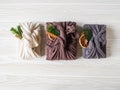 Eco-friendly fabric reusable gifts packaging with fir brunch, cinnamon stick and dry orange slice. Christmas reusable sustainable