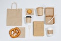 Eco friendly flat lay composition. Carton compostable products over white