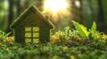 Eco-friendly green house model amidst sunlit forest environment Royalty Free Stock Photo