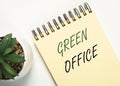 Eco friendly green office. Inscription on notebook, flatlay Royalty Free Stock Photo