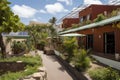 eco-friendly hotel, with solar panels on the roof and composting bins in the garden