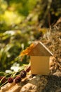 Eco Friendly house concept, Environment conservation concept, yellow fall autumn background. model home outdoors in a garden Royalty Free Stock Photo