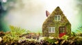 Eco friendly house concept with moss covered model Royalty Free Stock Photo