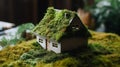 Eco Friendly House - Paper Home On Moss In Garden Royalty Free Stock Photo