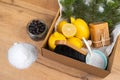 Eco-friendly and household cleaning tools, baking soda, salt, bamboo brush and luffa sponge on the kitchen table