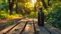 eco-friendly lifestyle, eco-friendly travel essentials a reusable water bottle on a park bench surrounded by greenery