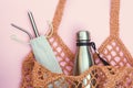 String bag with reusable water bottle and metal straws, go green and use no single use plastic