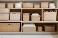 Eco-Friendly Linen Cupboard Organization with Neatly Folded Linens in Straw Baskets.