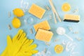 Eco friendly natural cleaners background. Cleaner sponges, gloves, baking soda, lemon, vinegar top view Royalty Free Stock Photo