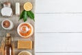 Eco-friendly natural cleaners: baking soda, soap, vinegar, salt, coffee, lemon and brush on a wooden table. Top view Royalty Free Stock Photo