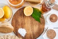 Eco-friendly natural cleaners: baking soda, soap, vinegar, salt, coffee, lemon and brush on a wooden table Royalty Free Stock Photo