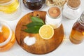 Eco-friendly natural cleaners: baking soda, soap, vinegar, salt, coffee, lemon and cloth with brushes on a wooden table Royalty Free Stock Photo