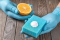 Eco-friendly natural cleaners lemon, baking soda and cloth on wooden table in hand on wooden table Royalty Free Stock Photo