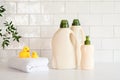 Eco friendly organic natural baby laundry detergent and soap gel bottle with branch of green leaves, towel and yellow duck on Royalty Free Stock Photo