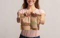 Eco-Friendly Package. Woman holding brown kraft paper doypack bags with weight groceries Royalty Free Stock Photo