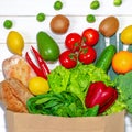 An eco-friendly paper bag with fresh food for a healthy diet Royalty Free Stock Photo