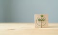 Eco-friendly products and responsible consumption concept. Reducing human intervention in ecosystems. Eco product icon on wooden