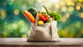 Eco friendly reusable shopping bag filled with vegetables on a blur background