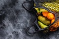 Eco friendly reusable shopping string bag, filled with fruits. Eco friendly, plastic free. Black background. Top view. Copy space Royalty Free Stock Photo