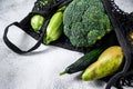 Eco friendly reusable shopping string bag, filled with vegetables. Eco friendly, plastic free. Gray background. Top view. Copy Royalty Free Stock Photo