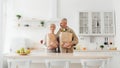 Eco friendly shopping, senior couple unpacking bag with organic food from supermarket Royalty Free Stock Photo