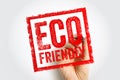 ECO FRIENDLY shown as a bold stamp held by a hand, creating a textured framed mark that highlights sustainability and Royalty Free Stock Photo