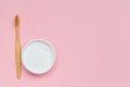 Eco friendly tooth brush and natural powder toothpaste isolated on pastel pink background, flat layout, copy space Royalty Free Stock Photo
