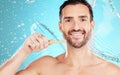 Eco friendly toothbrush, water and portrait of man on blue background for wellness, hygiene and brushing teeth. Cleaning Royalty Free Stock Photo