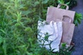 Eco friendly white canvas tote bag and paper bags for organic shopping on nature green background. Zero waste.